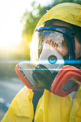 Coronavirus. A sanitation worker wearing a mask and cleaning the streets radiation virus with...