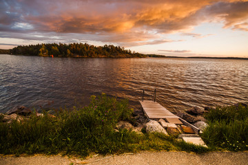 Fototapeta na wymiar Sunset sky and clouds over the lake