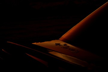 The sun reflects on the car