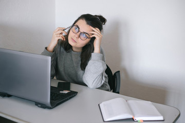 Young girl working with a laptop