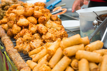 Delicious of traditional asian cuisine. Hot fried snacks at street market
