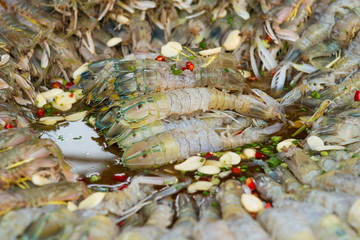 Heap of fresh cooked shrimps at asian seafood market