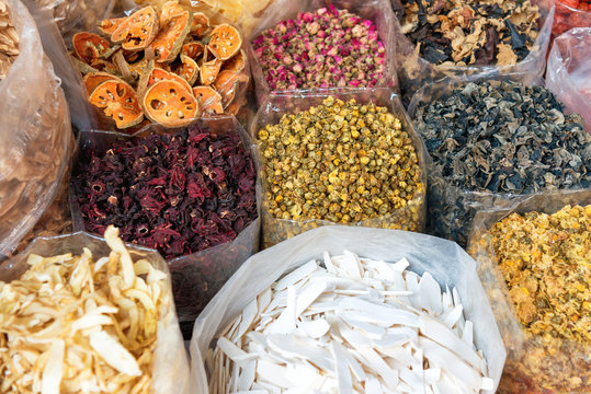 Heaps of tea, dried herbs and grocery at traditional chinese street market in asian town. Bangkok, Thailand