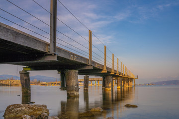 View of the Holzsteg, a reconstructed wooden bridge originally dating to the neolithic times, Upper Zurich Lake (Obersee), Switzerland