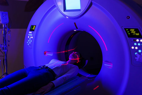 Computer Diagnosis Of The Pelvis Of A Girl In A Clinic With Blue And Red Lasers. CT Diagnostics Of Surgical And Oncological Pathologies, Gynecological And Urological Diseases, Vascular Pathology.