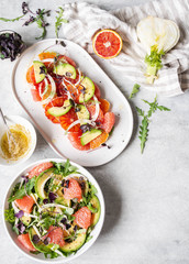 Flat lay various fennel salads with citruses on the table. top view