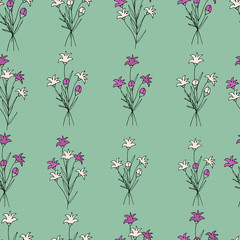 Cute seamless pattern of wildflowers and plants in doodle style. Spring flowers on a green background. Vintage pattern for decoration.