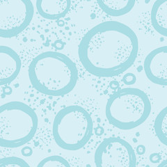Hand drawn circle seamless pattern on blue background. Brush strokes circles wallpaper.