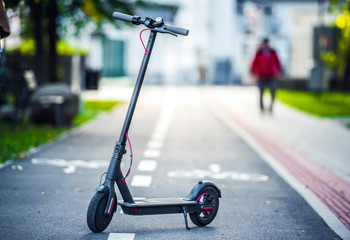 Close up details of electric scooter on the road. Ecological and urban transport in the city © Zedspider