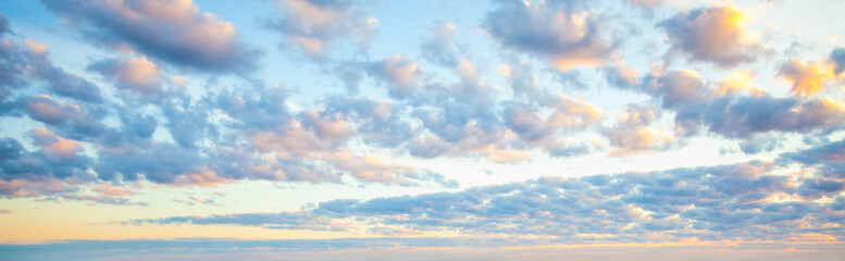 Blue sky clouds background. Beautiful landscape with clouds and orange sun on sky