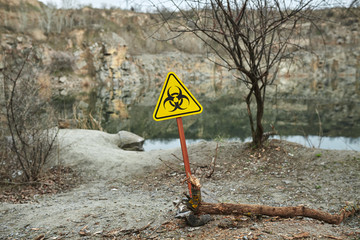 Girl in protective overalls on the nature. Biological protection suit. Personal protective equipment to prevent transmission of the virus. The concept of coronavirus, pandemic, flu and quarantine.
