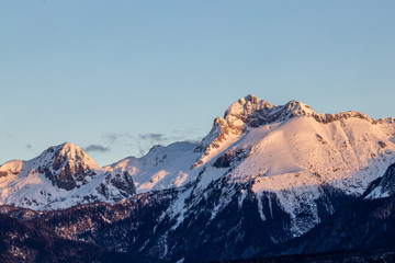 Fototapeta premium Sunlit Triglav peak from Bohinj valley, early light