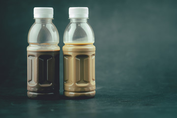 Tasty mocha coffee and cocoa milk in plastic bottle