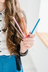 A female(woman) hands hold many pencils at home