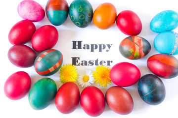 Colorful easter eggs and flowers isolated on white background.