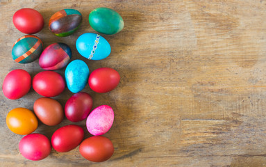 Colorful Easter eggs on old wooden background