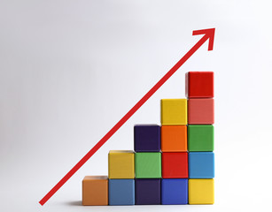 Career promotion concept. Stairs made of colorful cubes and arrow on white background