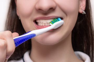 Brushing teeth with  toothbrush close-up. Dental hygiene and teeth care. oral care, dental hygiene...