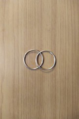 Female rings jewelry on wooden background