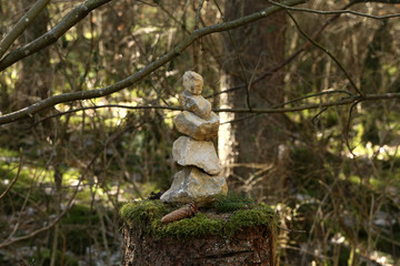 Pyramid built of stones stands in the forest