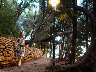 the girl walking in a national Park in Sveti Stefan. Montenegro