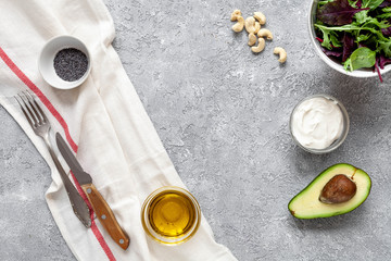 Fototapeta na wymiar Keto diet food: avocado, oil, cream, salad, chia seeds. Healthy fats concept. 