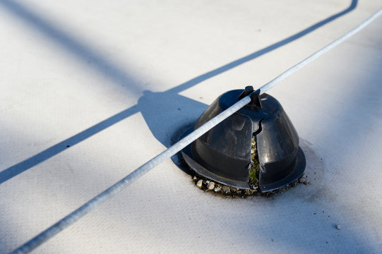 Broken foots holding lightning rod on the roof.