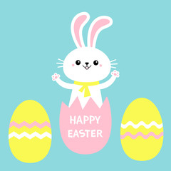 Happy Easter painted eggs. Rabbit bunny holding paw print hands up. Yellow scarf. Cute cartoon kawaii funny baby character. White farm animal. Blue background. Isolated. Flat design