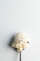 Coconut chocolate ice cream on a spoon