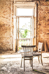 Fototapeta na wymiar old chair in the old house
