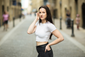 Portrait of a young woman in the street