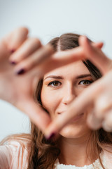 Fototapeta premium girl doing hand frame