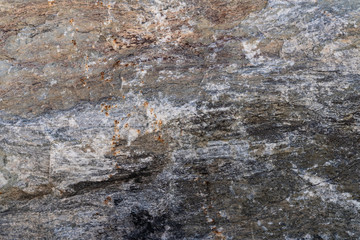 Texture of natural rock granite natural rock granite, magmatic structure with quartz and mica and traces of erosion.
