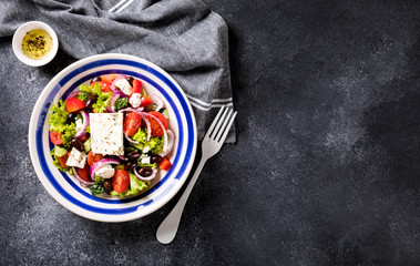 Greek salad of fresh vegetables, olives and feta. Traditional Mediterranean food.