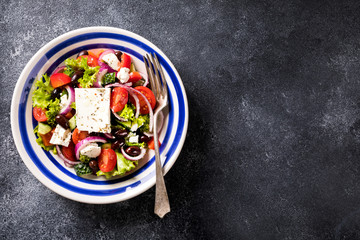 Greek salad of fresh vegetables, olives and feta. Traditional Mediterranean food.