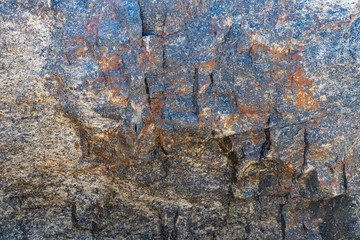 Texture of natural rock granite natural rock granite, magmatic structure with quartz and mica and traces of erosion.