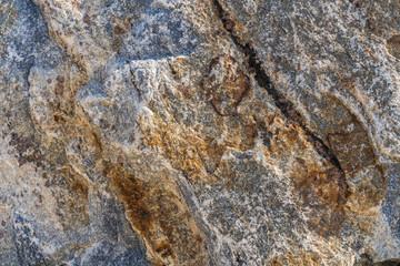 Texture of natural rock granite natural rock granite, magmatic structure with quartz and mica and traces of erosion.