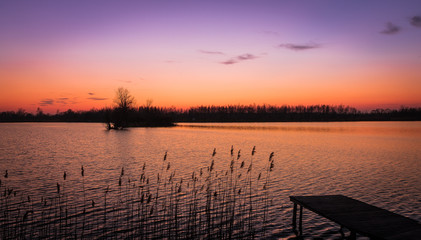 Fototapeta na wymiar Warm sunset over the ponds