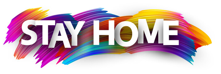 Big stay home sign over brush strokes background.