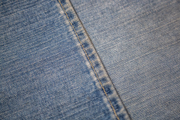 Blue textured surface of a thick cotton denim fabric