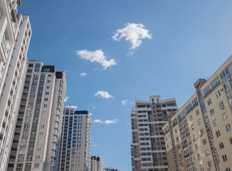 Obraz na płótnie Canvas facades of residential buildings low angle view against the sky