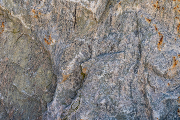 Obraz premium Texture of natural rock granite natural rock granite, magmatic structure with quartz and mica and traces of erosion.