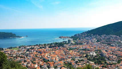 Top view of the town of Budva with high mountains.
