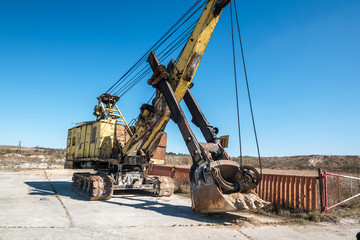 huge old rusty abandoned mining excavator