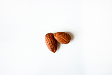 two almonds on white background