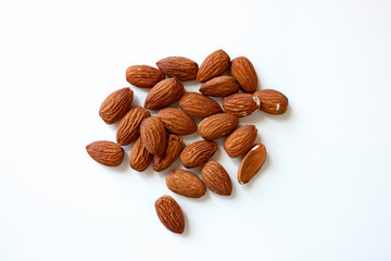 Group of almonds isolated on white background, close up