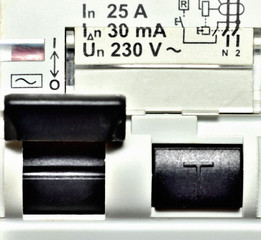 Modular electric circuit breakers. Residual current device and differential switch with test buttons. Close-up. Czech Republic standard.