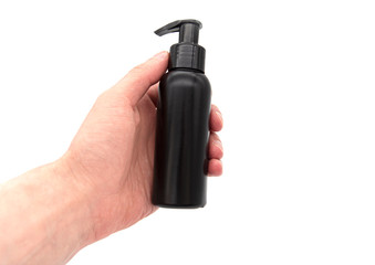 Naklejka premium Man holding plastic bottle or container for soap, gel or creme, isolated on white background