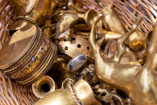 Close up of an assortment of brass collectible objects