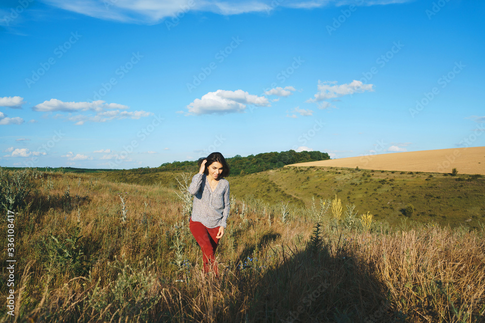 Sticker woman walking in field